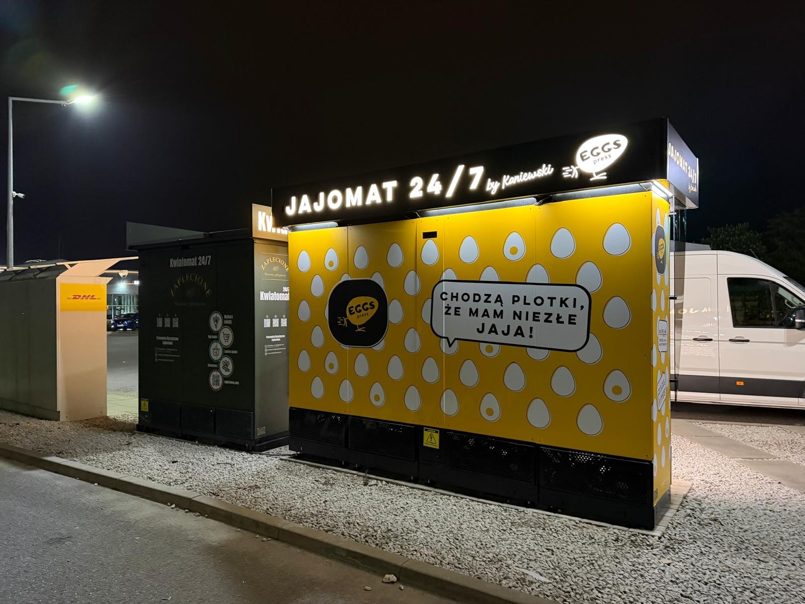Yellow branding on the side of an egg vending machine